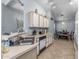 Compact kitchen showcasing tiled floors and access to the dining area at 8952 W Monte Vista Rd, Phoenix, AZ 85037