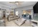 The living room showcases tile floors, ceiling fan, and a sliding door to access the covered patio at 8952 W Monte Vista Rd, Phoenix, AZ 85037