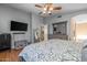 Spacious main bedroom featuring wood floors, neutral walls, and an ensuite bathroom at 8952 W Monte Vista Rd, Phoenix, AZ 85037