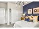 Comfortable bedroom featuring a modern chandelier, a bed with stylish pillows, and a closet at 9943 S Desert View Dr, Apache Junction, AZ 85120