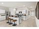 Eat-in kitchen with stainless steel appliances, bar stool seating, and open concept living at 9943 S Desert View Dr, Apache Junction, AZ 85120