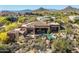 Aerial view of the home showing the pool and surrounding desert landscape at 10531 E Cinder Cone Trl, Scottsdale, AZ 85262