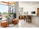 Inviting bar area with counter seating, picturesque window view, and access to the dining area, ideal for entertaining at 10531 E Cinder Cone Trl, Scottsdale, AZ 85262