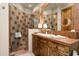 Beautiful bathroom with tiled shower, vanity, and glass enclosure at 10531 E Cinder Cone Trl, Scottsdale, AZ 85262