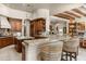 Spacious kitchen with granite countertops, custom cabinetry, and a large island offers a chef's dream at 10531 E Cinder Cone Trl, Scottsdale, AZ 85262