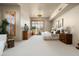 Light filled main bedroom featuring private views, carpeted floors, and neutral paint tones at 10531 E Cinder Cone Trl, Scottsdale, AZ 85262