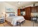 Bedroom with carpet, king bed, built-in desk and shelving at 10531 E Cinder Cone Trl, Scottsdale, AZ 85262