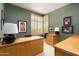 Comfortable home office featuring modern light fixtures, neutral paint tones, and bright, natural light at 10531 E Cinder Cone Trl, Scottsdale, AZ 85262