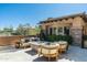 Outdoor living area with seating, fire pit, and desert landscaping at 10531 E Cinder Cone Trl, Scottsdale, AZ 85262