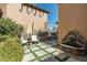 Cozy outdoor seating area with a fountain feature and desert landscaping at 10531 E Cinder Cone Trl, Scottsdale, AZ 85262