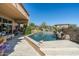 Outdoor patio area with swimming pool and landscaping at 10531 E Cinder Cone Trl, Scottsdale, AZ 85262