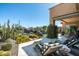 Outdoor lounge area featuring a pool, spa and desert landscape at 10531 E Cinder Cone Trl, Scottsdale, AZ 85262