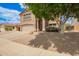 Inviting two-story home with a well-manicured lawn, two-car garage, and charming curb appeal at 10566 E Bogart Ave, Mesa, AZ 85208