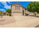 Beautiful two-story home featuring a spacious driveway, a two-car garage, and a well-landscaped front yard at 10566 E Bogart Ave, Mesa, AZ 85208