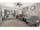 Comfortable living room features plush seating, neutral tones, and ample natural light, creating a relaxing atmosphere at 10566 E Bogart Ave, Mesa, AZ 85208