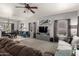 Spacious living room featuring a comfortable sofa, large windows, and stylish decor, perfect for relaxation at 10566 E Bogart Ave, Mesa, AZ 85208