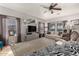 Spacious living room with comfortable seating, stylish decor, and plenty of natural light, creating a warm and inviting space at 10566 E Bogart Ave, Mesa, AZ 85208