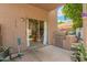 A cozy outdoor patio with BBQ, sliding glass doors and garden pots and ample space at 10566 E Bogart Ave, Mesa, AZ 85208