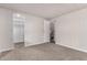 Bedroom with carpet, neutral walls, access to closet and bathroom at 11000 N 91St Ave # 101, Peoria, AZ 85345