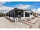 Beautiful exterior of a well-maintained home, featuring desert landscaping and a screened-in porch at 11000 N 91St Ave # 101, Peoria, AZ 85345