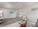 Bright living room featuring wood flooring, neutral walls, and an open floor plan at 11000 N 91St Ave # 101, Peoria, AZ 85345