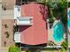 Aerial view of a home with a red tile roof and backyard pool at 11106 E Clinton St, Scottsdale, AZ 85259