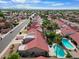 Beautiful community with red tile roofs, palm trees, and several homes with backyard pools at 11106 E Clinton St, Scottsdale, AZ 85259