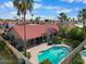 Enjoy outdoor living with a private pool, covered patio, and lush tropical landscaping at 11106 E Clinton St, Scottsdale, AZ 85259