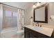 Bathroom featuring vanity, and tub-shower combination at 11106 E Clinton St, Scottsdale, AZ 85259