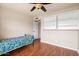 Bedroom with wood floors, built-in shelving, and natural light at 11106 E Clinton St, Scottsdale, AZ 85259