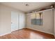 Bedroom with wood floors, closet, and built-in shelving at 11106 E Clinton St, Scottsdale, AZ 85259