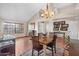 Cozy dining area featuring a chandelier and hardwood floors adjacent to the foyer at 11106 E Clinton St, Scottsdale, AZ 85259