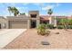 Charming single-story home featuring a low-maintenance desert landscape and a welcoming two-car garage at 11106 E Clinton St, Scottsdale, AZ 85259
