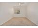 Bright bedroom with window, ceiling fan and plush carpet at 12451 W Nadine Way, Peoria, AZ 85383