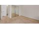 Bedroom with neutral carpet, double mirrored closet doors, and easy access to hall at 12451 W Nadine Way, Peoria, AZ 85383