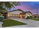 Charming house with well-kept lawn and large driveway leading to a spacious two-car garage at 12451 W Nadine Way, Peoria, AZ 85383