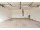 Spacious two-car garage with ample room for storage and vehicle parking, plus a water heater at 12451 W Nadine Way, Peoria, AZ 85383