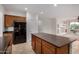 Bright kitchen showcasing a center island, modern appliances, and wooden cabinetry at 12451 W Nadine Way, Peoria, AZ 85383