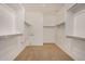 Spacious walk-in closet featuring ample shelving and storage space for organization at 12451 W Nadine Way, Peoria, AZ 85383