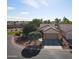 Aerial view of a single-story home with a tile roof and well-manicured landscaping at 12937 W El Sueno Ct, Sun City West, AZ 85375