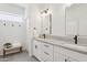 Modern bathroom featuring double sinks, gray countertops, and neutral paint at 12937 W El Sueno Ct, Sun City West, AZ 85375