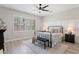Neutral bedroom with a metal bed frame and natural light at 12937 W El Sueno Ct, Sun City West, AZ 85375