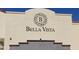 Close up of community sign featuring 'Bella Vista' in black text at 12937 W El Sueno Ct, Sun City West, AZ 85375