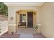 Charming front porch with seating, decorative accents, and inviting entryway enhances curb appeal at 12937 W El Sueno Ct, Sun City West, AZ 85375