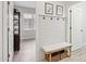 Hallway featuring a bench and hanging coat rack at 12937 W El Sueno Ct, Sun City West, AZ 85375