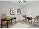 Office features wood-look floors, a vintage desk, and stylish accents at 12937 W El Sueno Ct, Sun City West, AZ 85375
