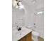Bathroom featuring a single sink vanity, tiled shower-tub combination, and a large mirror at 13620 N 82Nd Ln, Peoria, AZ 85381
