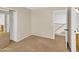 Neutral bedroom with closet featuring mirrored doors and doorway leading to bathroom at 13620 N 82Nd Ln, Peoria, AZ 85381