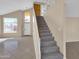 Entryway with staircase featuring tile floors, and soaring ceilings at 13620 N 82Nd Ln, Peoria, AZ 85381