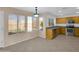 Eat-in kitchen with granite countertops, stainless steel appliances, tile flooring and ample natural light at 13620 N 82Nd Ln, Peoria, AZ 85381